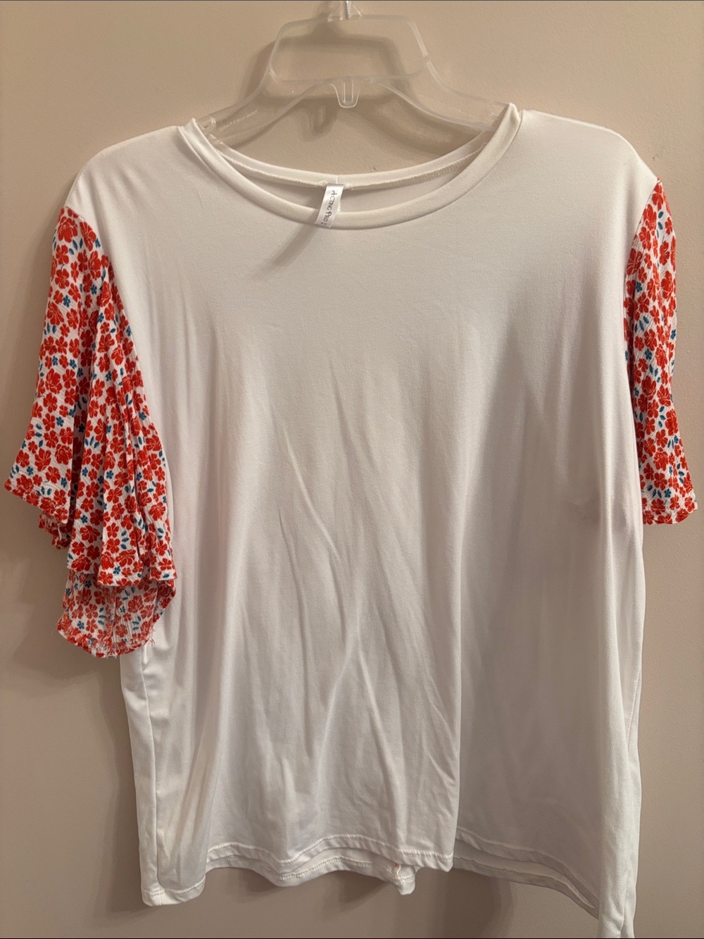 Acting Pro White Tee with Red Floral Ruffle Sleeves